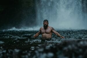 man standing in a lake
