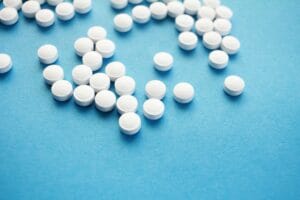 medication pills on a blue background