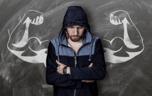 man leaning on wall